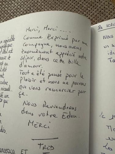 a page of a book with handwriting on it at La Maison des Plaisirs Love room in Champigny-sur-Yonne
