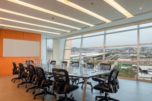 a conference room with a long table and chairs at Holiday Inn Guayaquil Airport by IHG in Guayaquil
