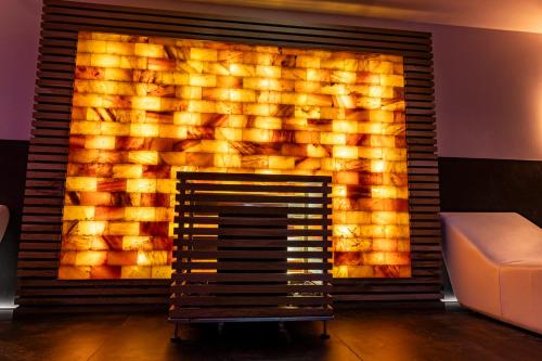 a fireplace in a living room with a fire place at The Moon Boutique Hotel & Spa in Florence