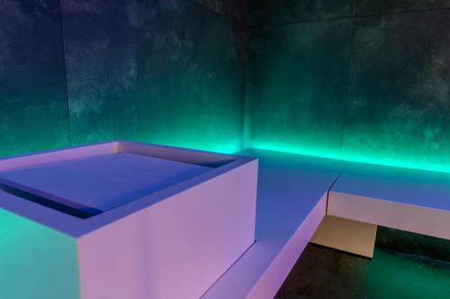a blue and white bench in a green room at The Moon Boutique Hotel & Spa in Florence