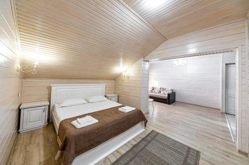 a bedroom with a large bed in a room at Diamond Resort White in Bukovel