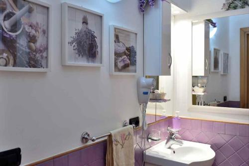 a bathroom with a sink and a mirror at Villa Anna in Minori