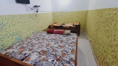 a bedroom with two beds in a room at CLASSIC GUEST HOUSE in Rāmgarh