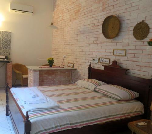 Un pat sau paturi într-o cameră la Chalé na Cachoeira