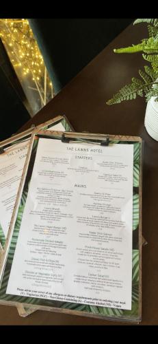 a menu sitting on top of a table at The Lawns Hotel in Derby