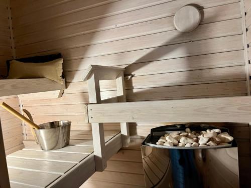 a room with a sauna with a bowl of food at Central 2 Br in Tampere