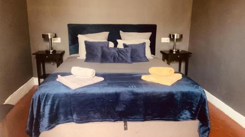 a bedroom with a bed with two towels on it at Casa Roma Montpellier Bed&Breakfast chambres d hôte in Montpellier