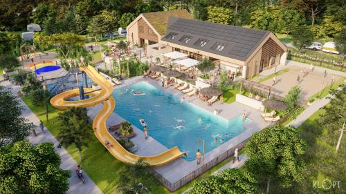 an overhead view of a swimming pool at a resort at Chalet type F in Voorthuizen