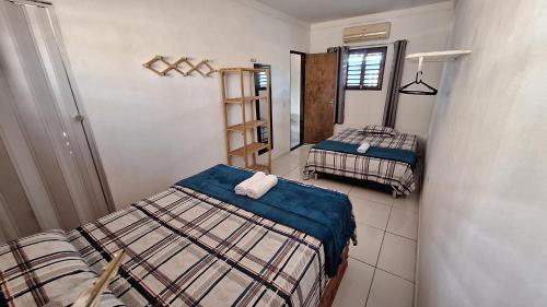 Postel nebo postele na pokoji v ubytování Sol & Vento Chalés
