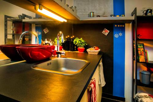 a kitchen with a sink and a counter top at The Book Nest in Ljubljana