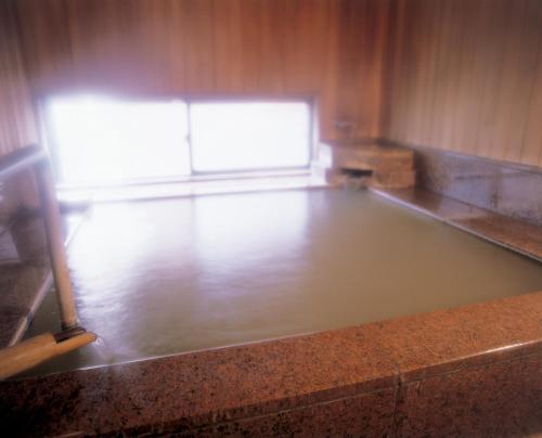 a empty dance floor in a room with a window at Ryokan Sakaya in Nozawa Onsen