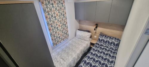 Llit o llits en una habitació de Lynton lodges ATLAS