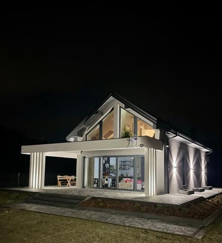 a house is lit up at night at Flora & Sauna Kamieńczyk Konwaliowa 8 
