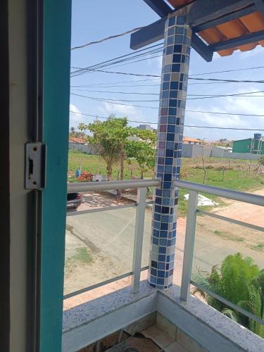 a window with a view of a street at Kitnet no Farol Velho in Salinópolis