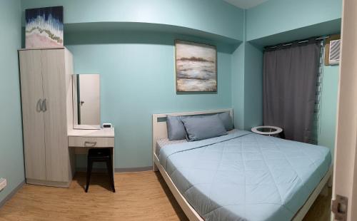 Postel nebo postele na pokoji v ubytování Lovely 1 Bedroom unit in Avida w/ WiFi (upto 4 pax)