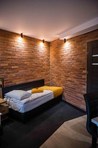 Кровать или кровати в номере Apartments in Bukowina