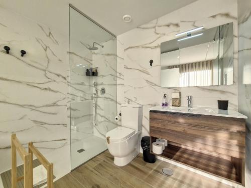 a bathroom with a toilet and a sink and a shower at Los Alcazares Velapi - 0810 in San Javier