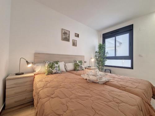 a bedroom with a large bed and a window at Los Alcazares Velapi - 0810 in San Javier