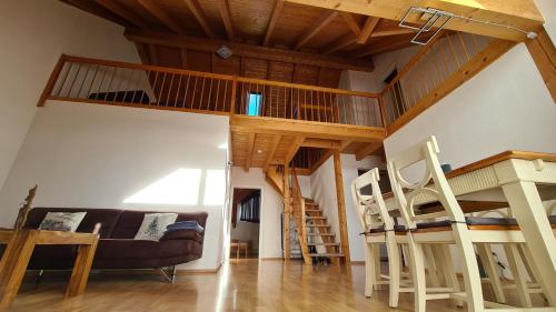 a living room with a loft bed and a couch at Ferienwohnung CELI in Rottweil
