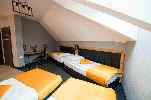 Кровать или кровати в номере Apartments in Bukowina