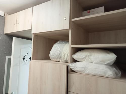a cupboard with two pillows sitting in it at CLUB NAUTIC 3 in Empuriabrava