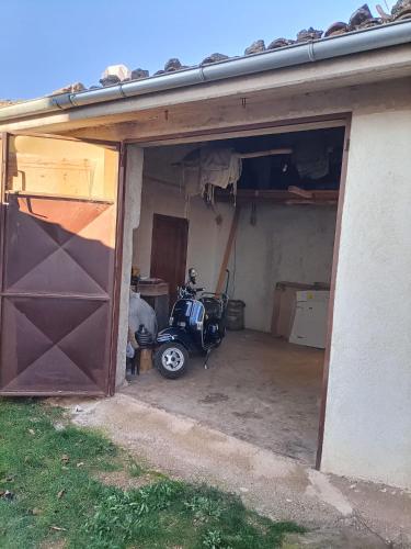 a motorcycle parked inside of a garage at A Casa dei Nonni in San Demetrio neʼ Vestini