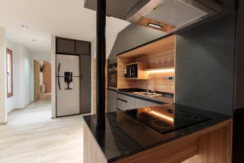 a kitchen with a sink and a counter top at Cabañas Tierra Mistica in Ushuaia