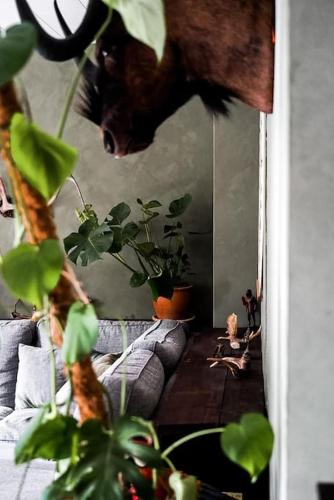 a woman sitting on the floor in front of a mirror at Country Penthouse in Falun