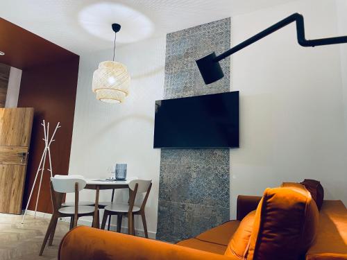 Televízia a/alebo spoločenská miestnosť v ubytovaní Port Przewłoka - Apartamenty