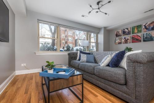 a living room with a couch and a table at The Bright Retreat in Andersonville in Chicago