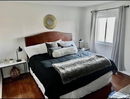 a bedroom with a large bed and a mirror at Downtown Nashville Riverfront unit 790 in Nashville