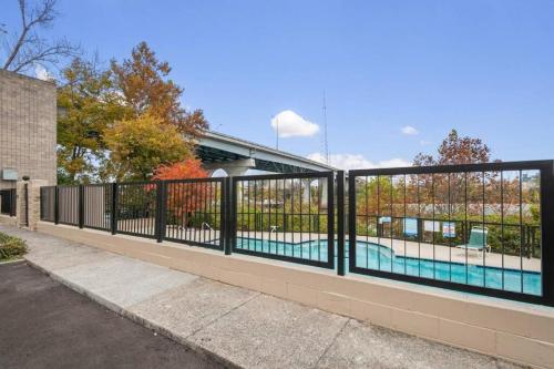 a black fence with a swimming pool behind it at Downtown Nashville Riverfront unit 790 in Nashville