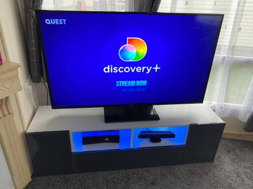 a flat screen tv sitting on top of a dresser at Bobbys Bolthole2 in Heysham