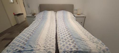 a large bed in a room with at Studio Ferienwohnung Untergeschoss in Ostrach
