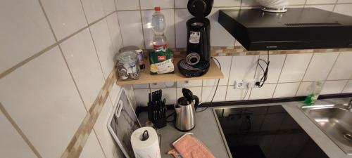 a small kitchen with a counter and a sink at Studio Ferienwohnung Untergeschoss in Ostrach