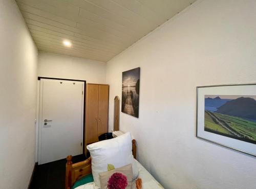 a bedroom with a bed and a picture on the wall at Single room for you in Hünxe