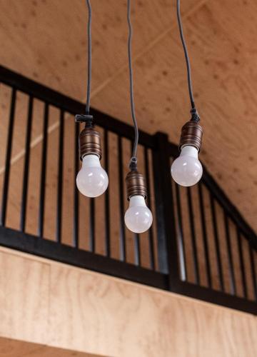 a group of three lights hanging from a ceiling at Le Crustacé 2 a 4 personnes in Nouvelle