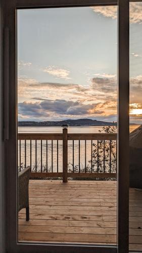 a view of the ocean from a balcony at Le Crustacé 2 a 4 personnes in Nouvelle