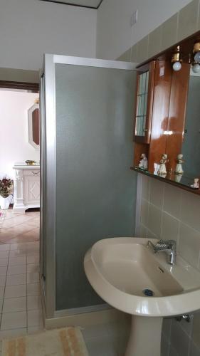 a bathroom with a sink and a shower at Chiara Apartment in Mestre