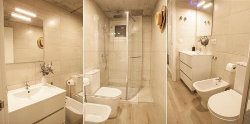 a bathroom with a toilet and a sink and a shower at Apartamentos RG Hospital Valme in Seville