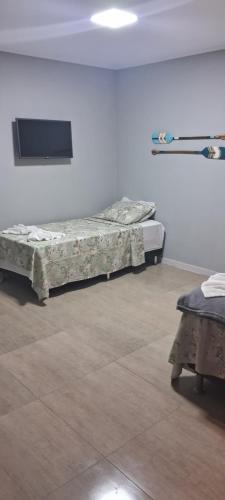 Cama o camas de una habitación en Pousada Canoa dos Anjos suítes