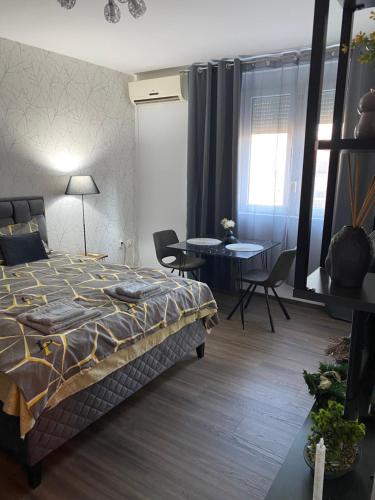 Postel nebo postele na pokoji v ubytování Apartman Felix