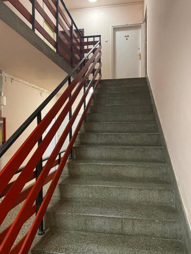 a flight of stairs in an office building at Apartman Felix in Zvezdara