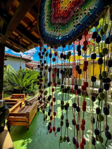 a bunch of beads hanging from a ceiling at HOSTEL BADULACK in Capitólio