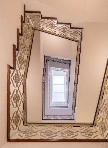 a mirror in a room with a window at Sky PDL in Ponta Delgada