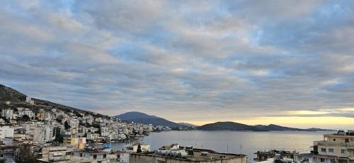 a view of a city and a body of water at Joen Apartments in Sarandë