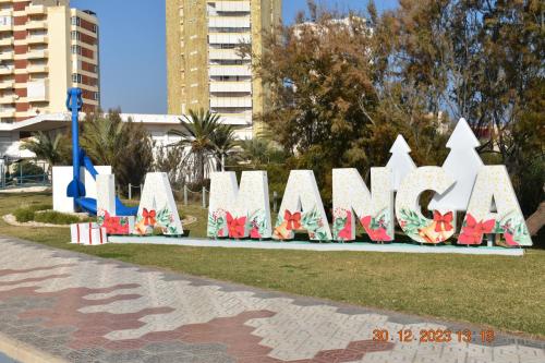 a large sign that says miami in a park at Alaïa Apartamentos in Playa Paraiso
