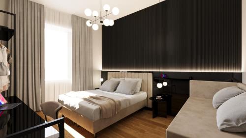 a bedroom with a bed and a couch at Home at Rome Luxury Navona in Rome