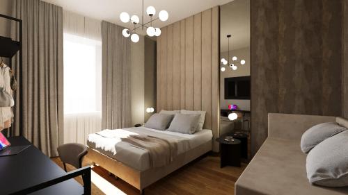 a bedroom with a bed and a couch at Home at Rome Luxury Navona in Rome