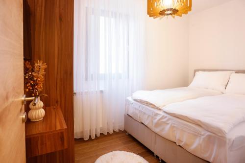 Ένα ή περισσότερα κρεβάτια σε δωμάτιο στο Apartmani Aria Jahorina